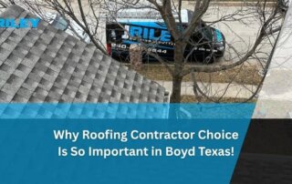 View from roof showing a J. Riley Roofing & Gutters vehicle parked on the street.